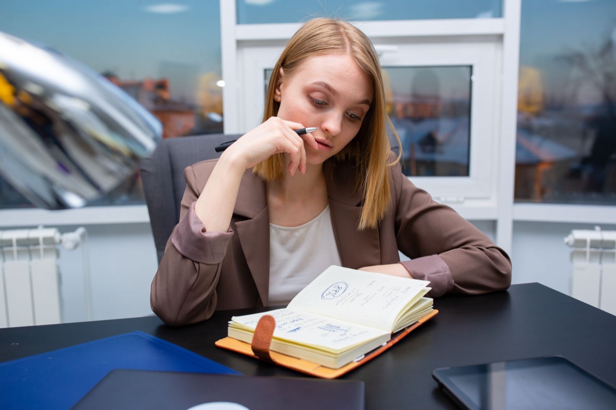 Salesperson with notebook and pen