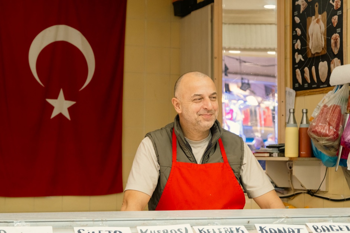 Salesperson and customer in outdoor market